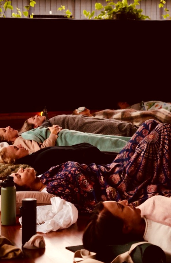 Participants resting during a sound and breath journey