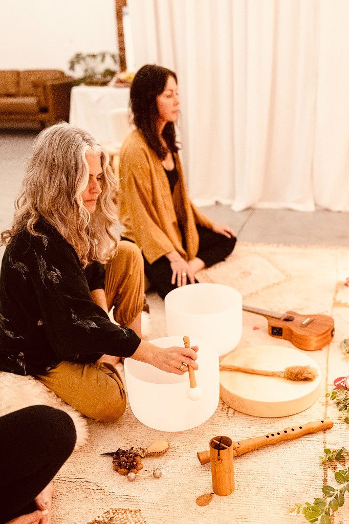 Amanda facilitating a sound and breath journey with crystal singing bowls